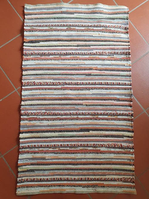 Fleckerlteppich in orange und braun